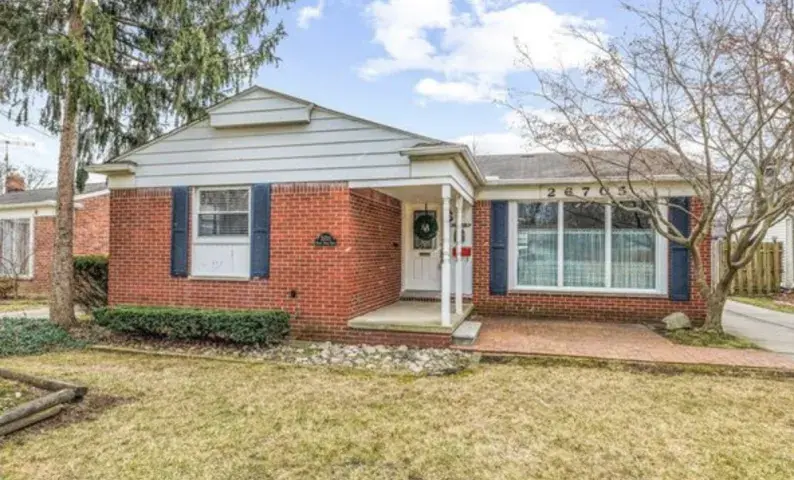 Brick home with a driveway and front yard in Center Line, MI & Allen Park, MI