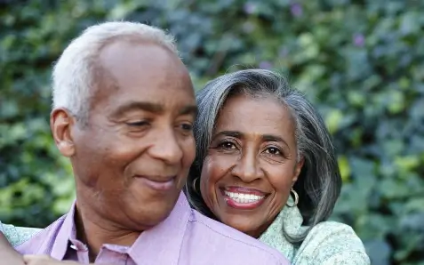 Older couple sharing a loving moment in Detroit, MI